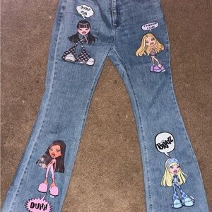 Dolls Kill Blue Cartoon Patch Flare Jeans